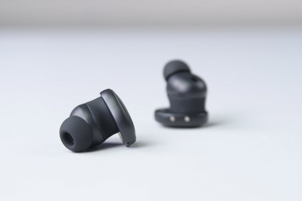 The Fairbuds, black earbuds, on a white background